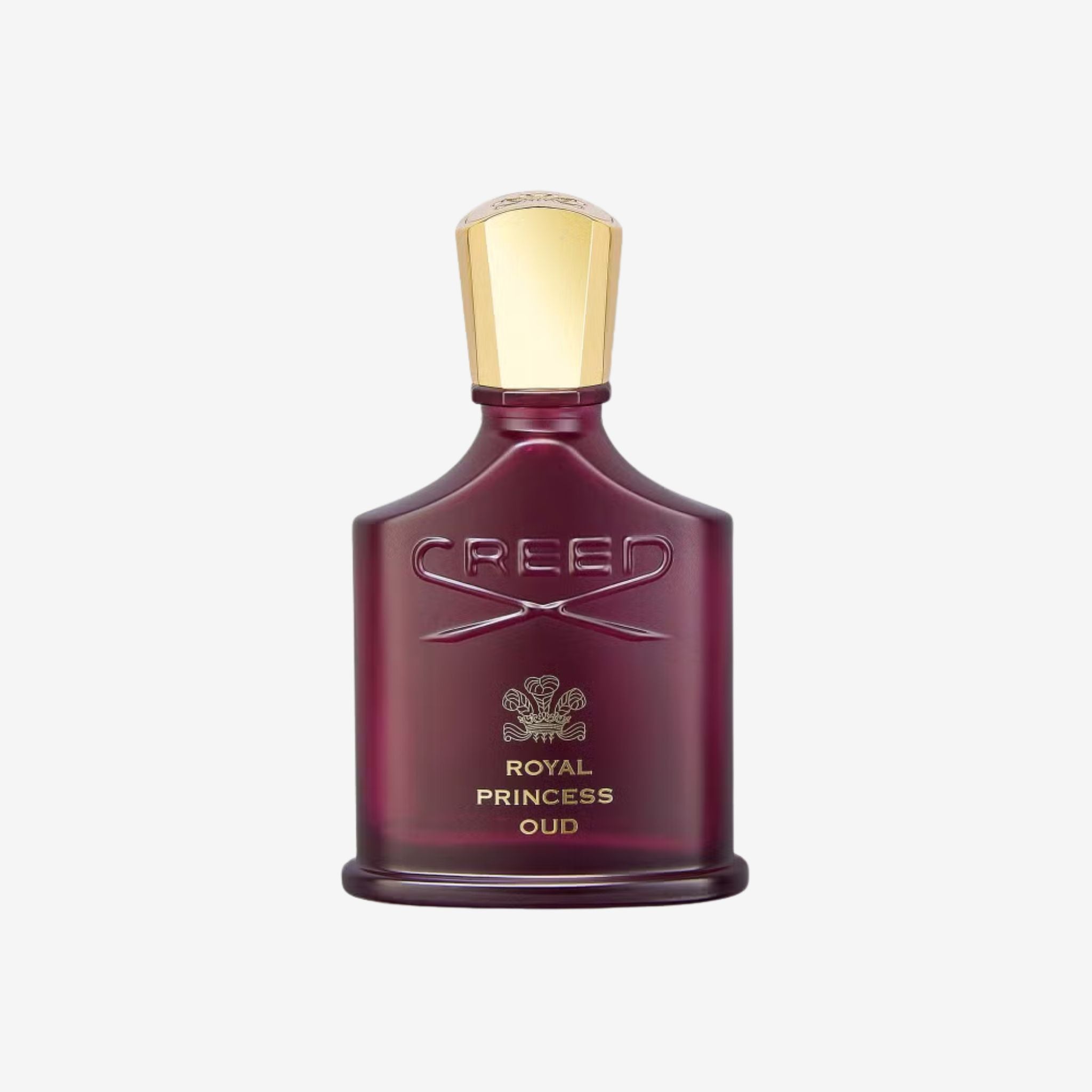 Close-up of Creed Royal Princess Oud bottle highlighting its elegant red design and gold-embossed Creed detailing.