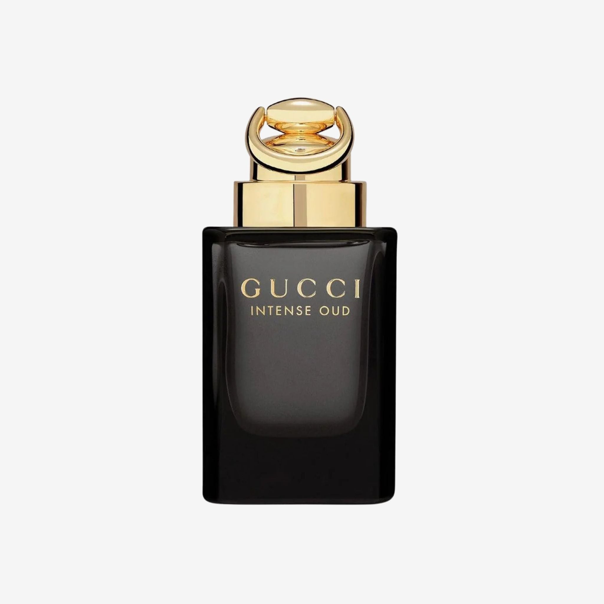 Gucci Intense Oud perfume bottle with gold cap on a white background