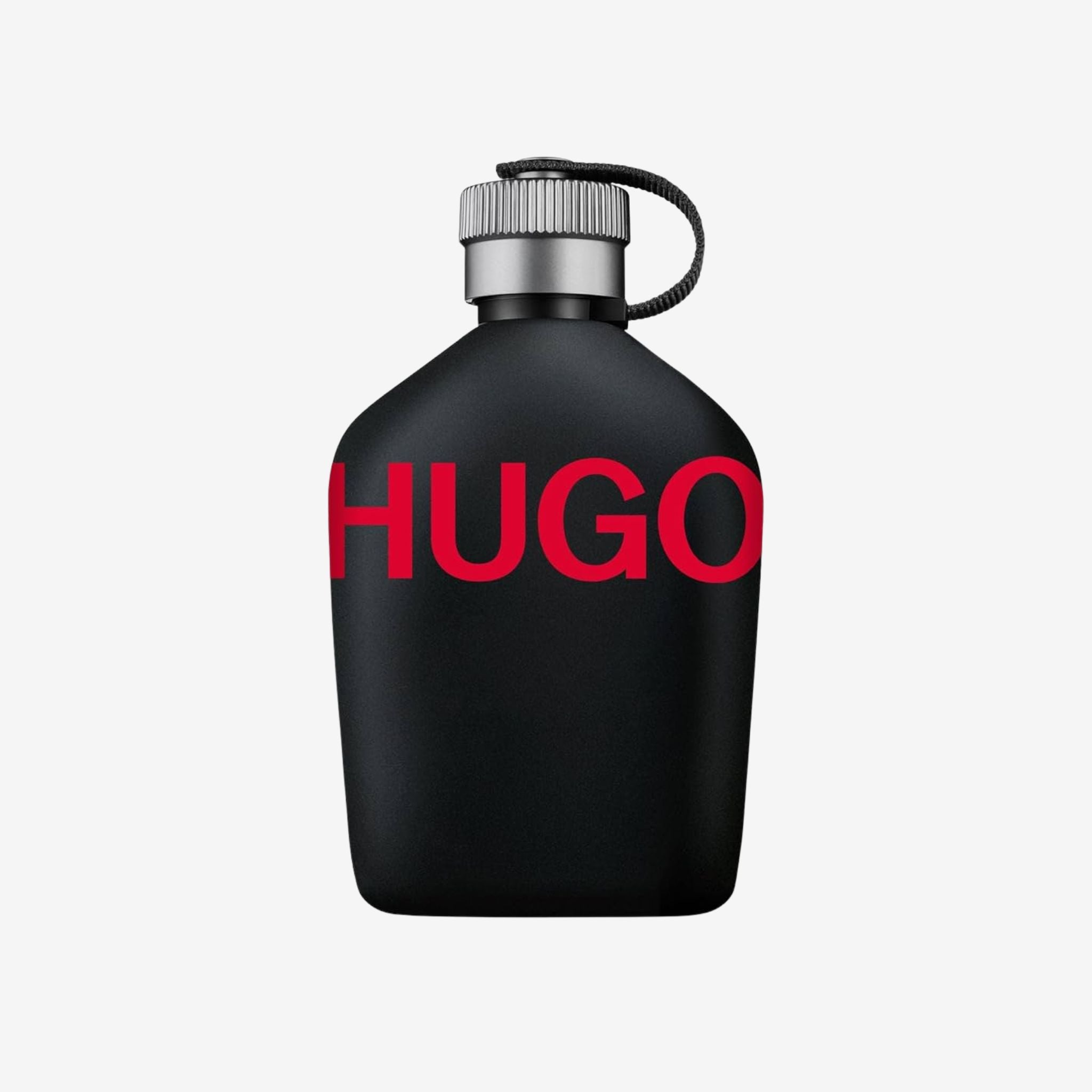 Close-up of Hugo Boss Just Different EDT bottle showcasing its matte black flask design with red Hugo logo.