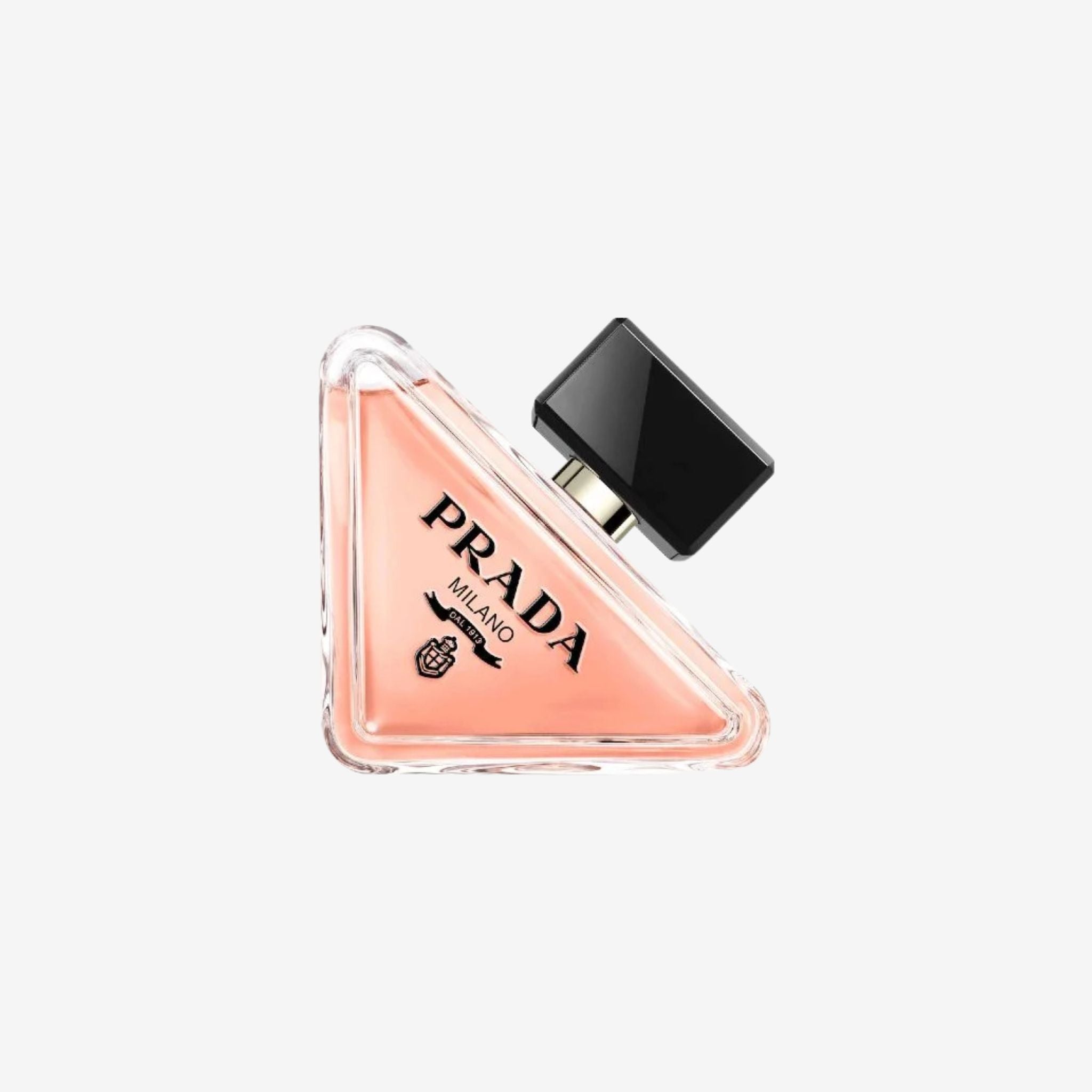 Close-up of Prada Paradoxe Women EDP 90ml bottle showcasing the signature triangular design and soft pink fragrance inside.